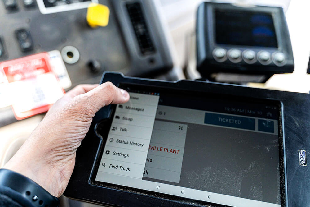 man holding trackit tablet